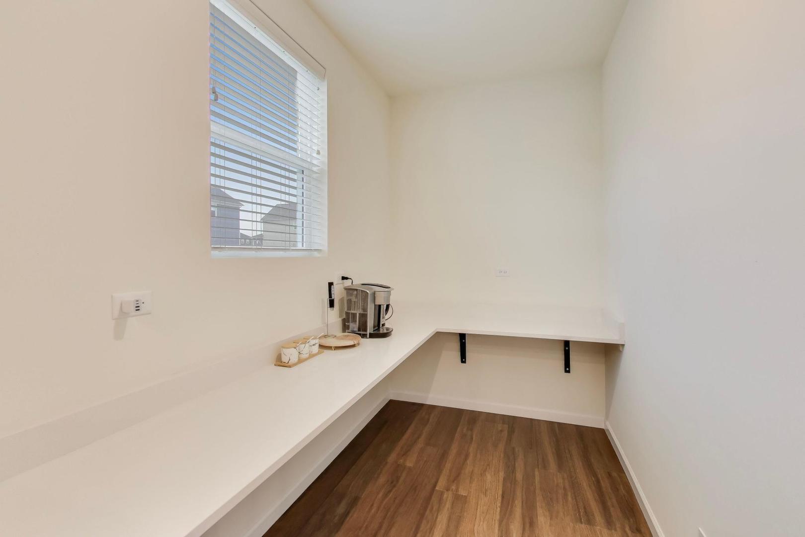 3744 Peregrine Way Elgin, IL 60124 - Photo 7 of 33 a bathroom with a sink and a window