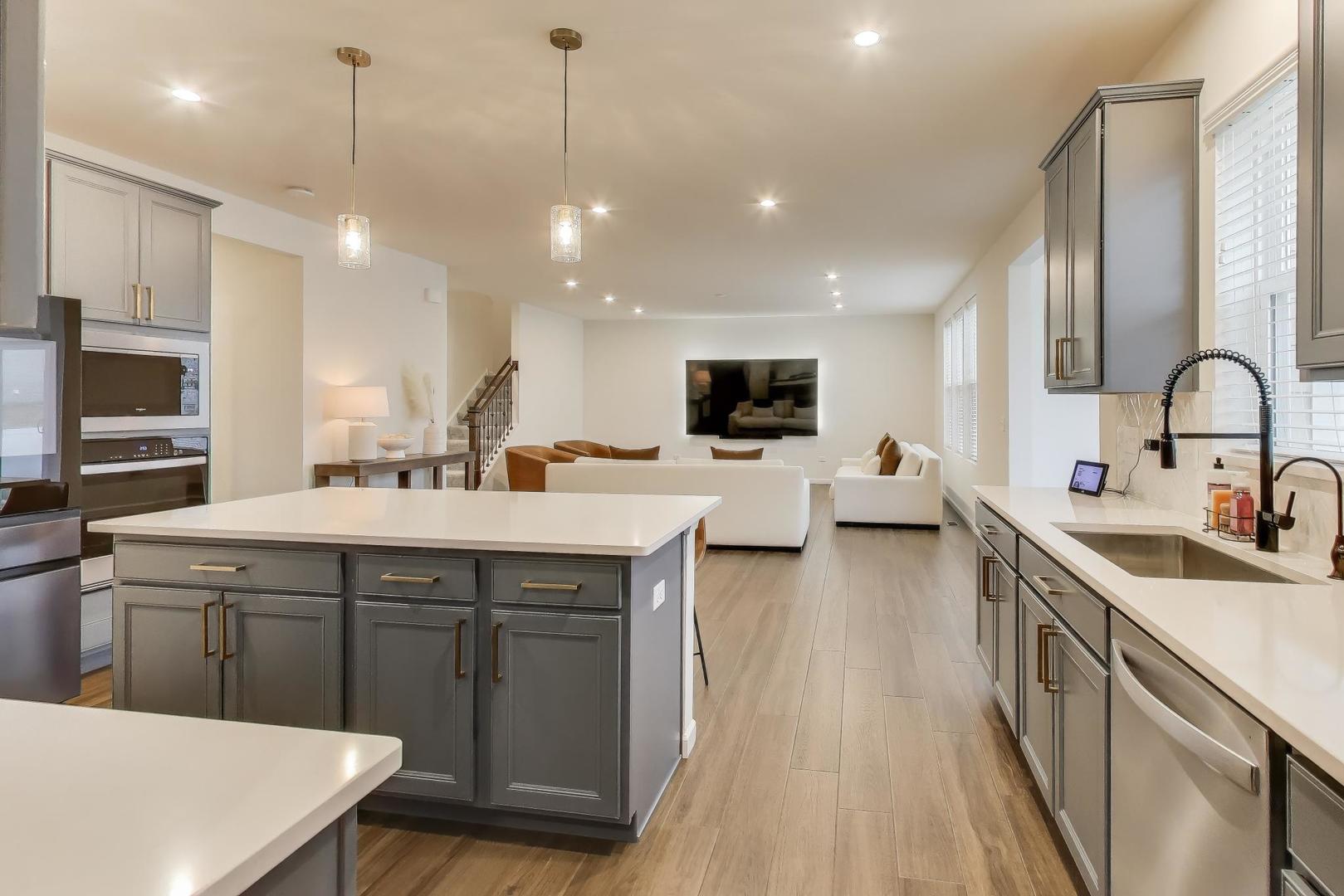 3744 Peregrine Way Elgin, IL 60124 - Photo 8 of 33 a kitchen with a sink a counter top space appliances and cabinets