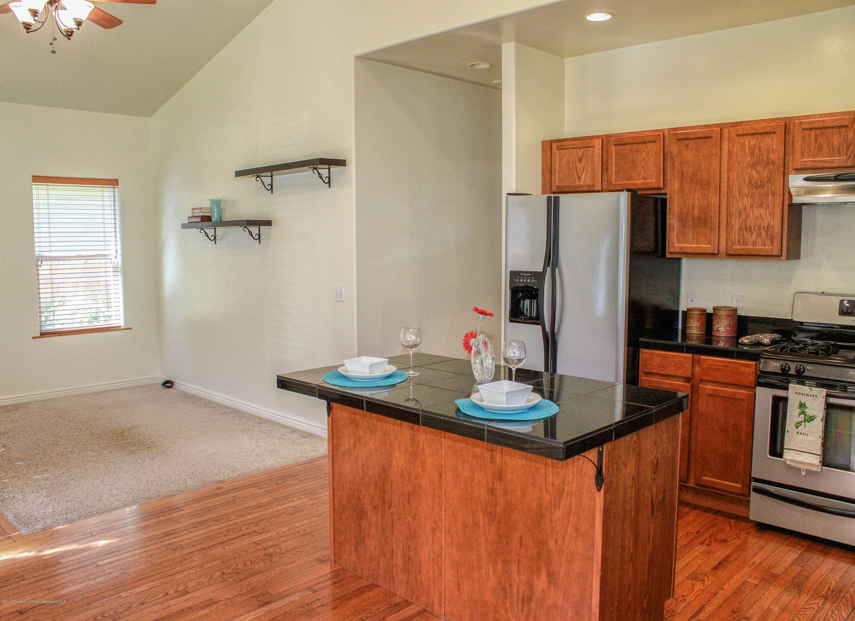335 Rio Grande Avenue New Castle, CO 81647 - Photo 4 of 8 kitchen into living