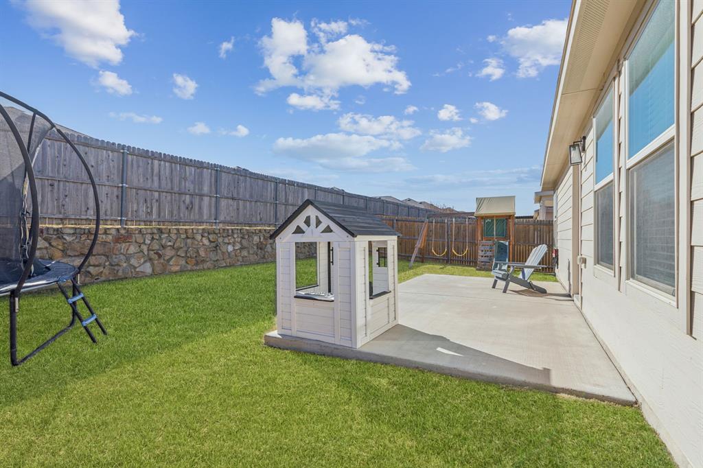 437 Frio Pass Trail Fort Worth, TX 76052 - Photo 21 of 28 a view of a house with backyard and porch