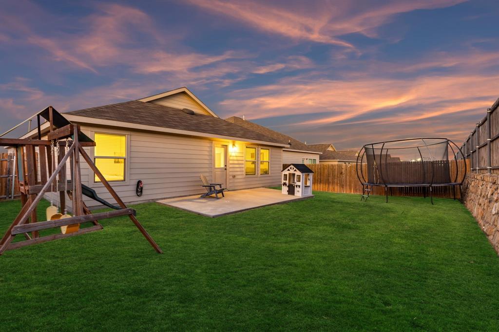 437 Frio Pass Trail Fort Worth, TX 76052 - Photo 24 of 28 a view of a backyard with furniture