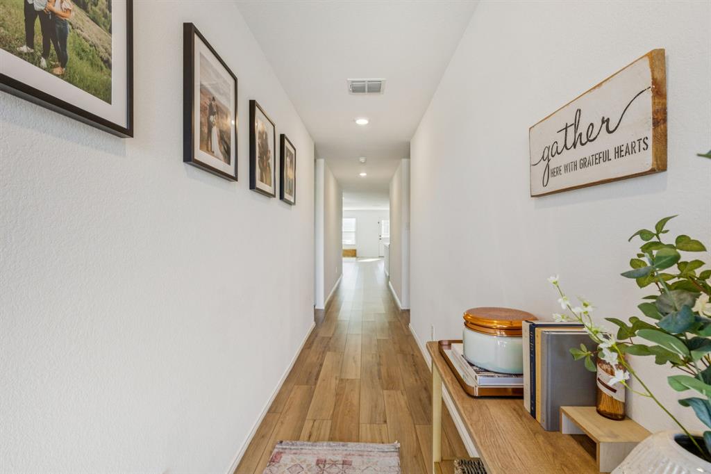 437 Frio Pass Trail Fort Worth, TX 76052 - Photo 4 of 28 a very nice looking room with a potted plant