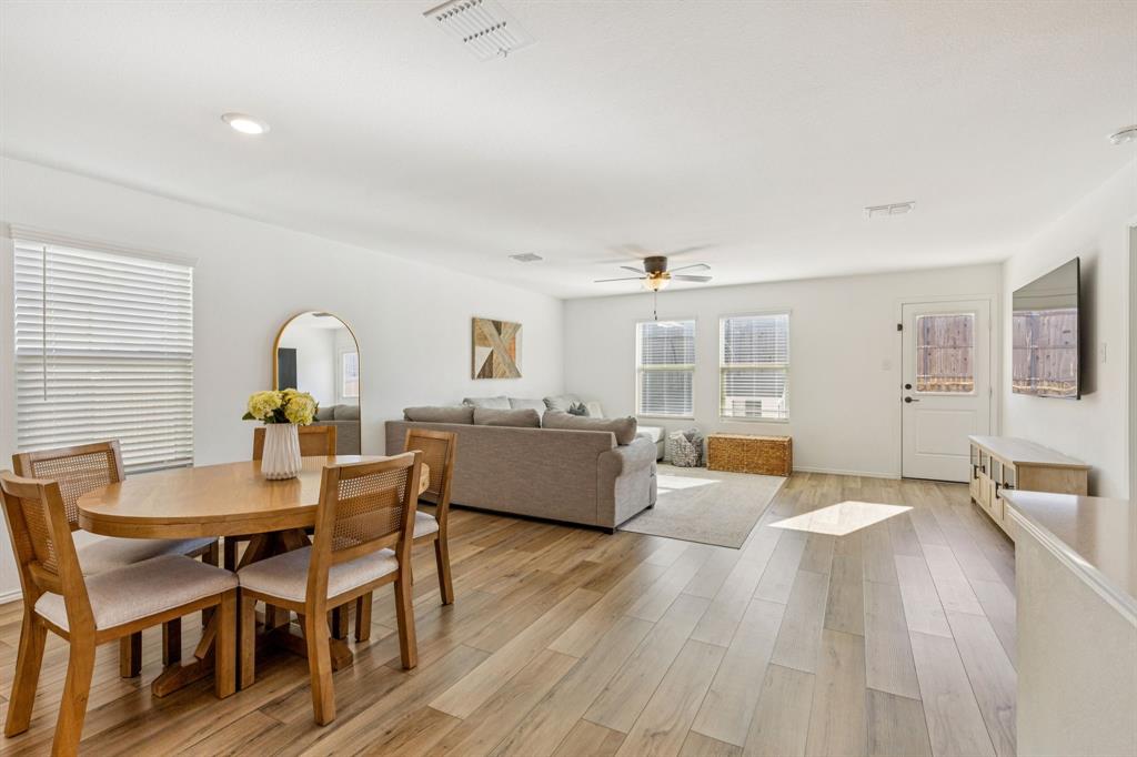 437 Frio Pass Trail Fort Worth, TX 76052 - Photo 6 of 28 a view of a dining room with furniture and wooden floor