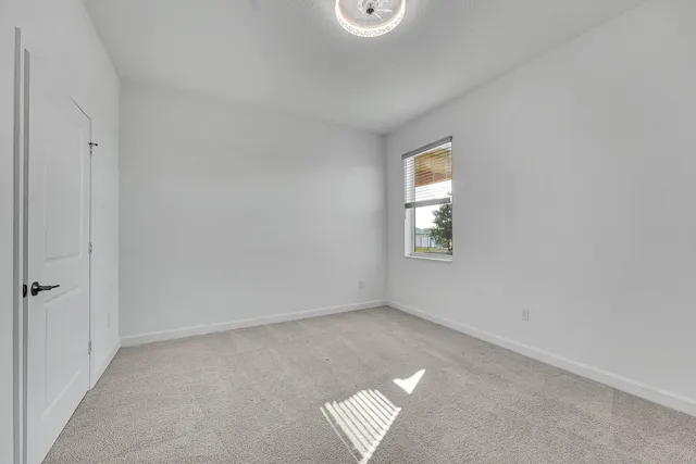 a bathroom with a shower sink vanity mirror and toilet