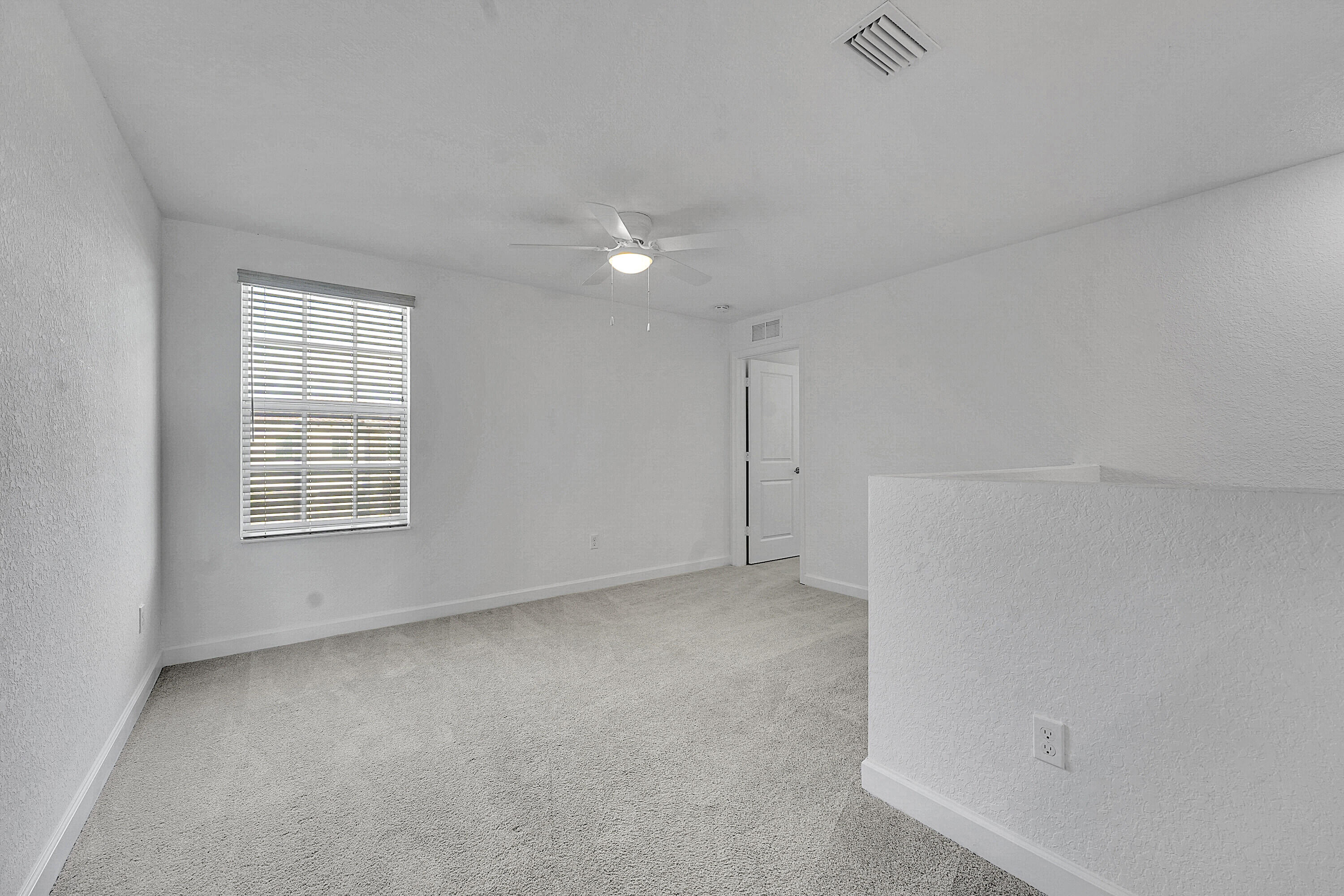 13096 Northwest Copper Creek Drive Port St. Lucie, FL 34987 - Photo 21 of 64 a view of an empty room with a window