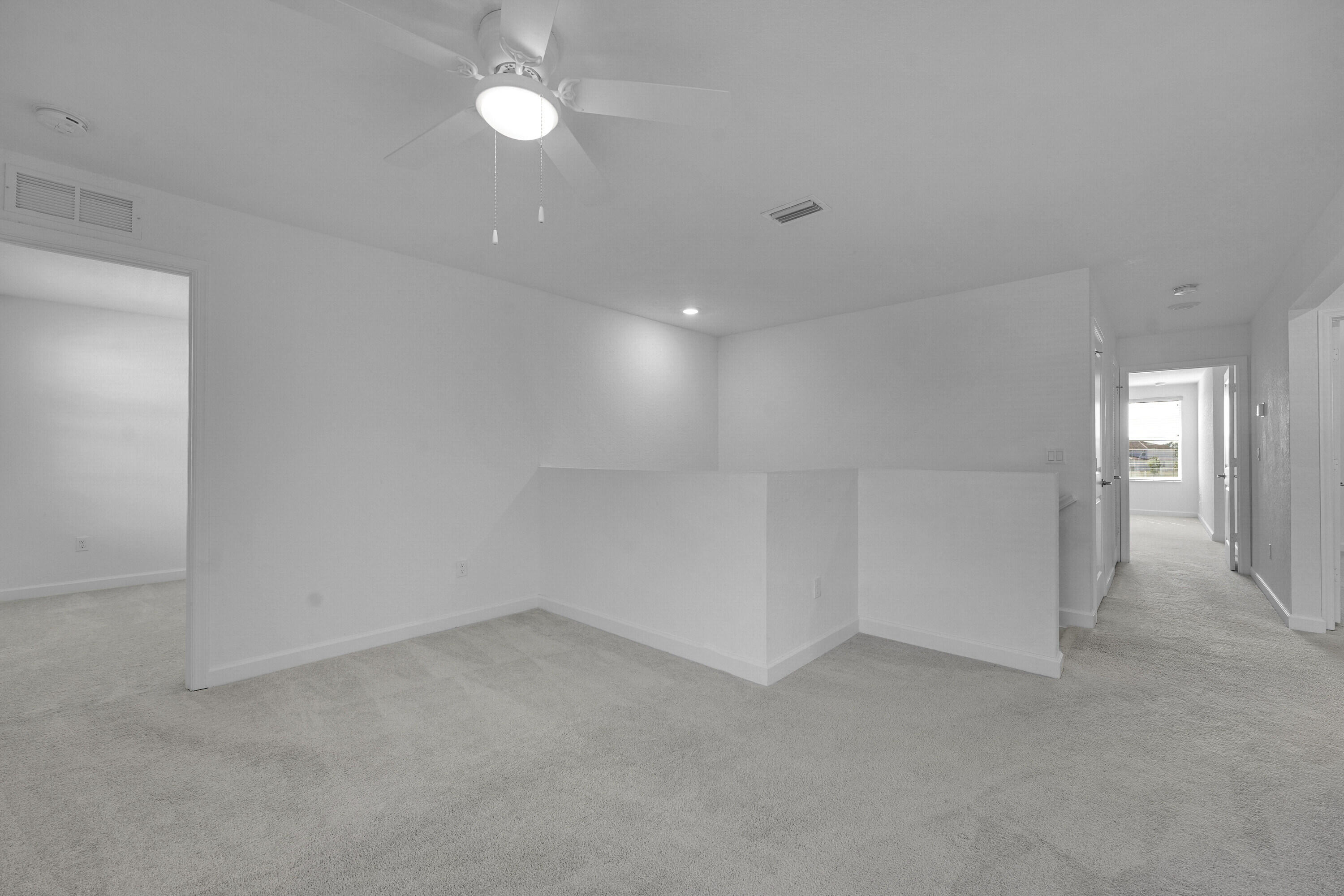 13096 Northwest Copper Creek Drive Port St. Lucie, FL 34987 - Photo 22 of 64 an empty room with entrance and windows