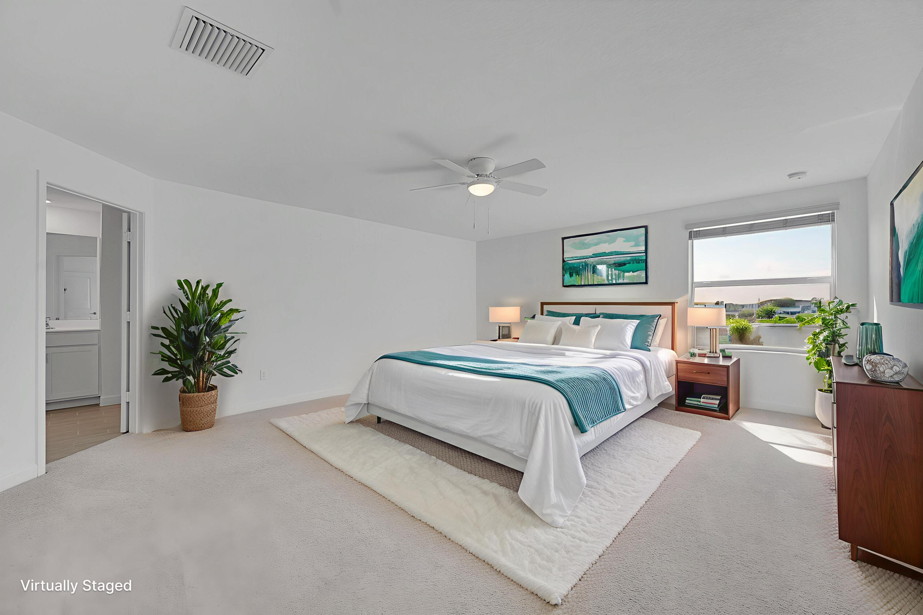 13096 Northwest Copper Creek Drive Port St. Lucie, FL 34987 - Photo 23 of 64 a spacious bedroom that has a bed and a potted plant