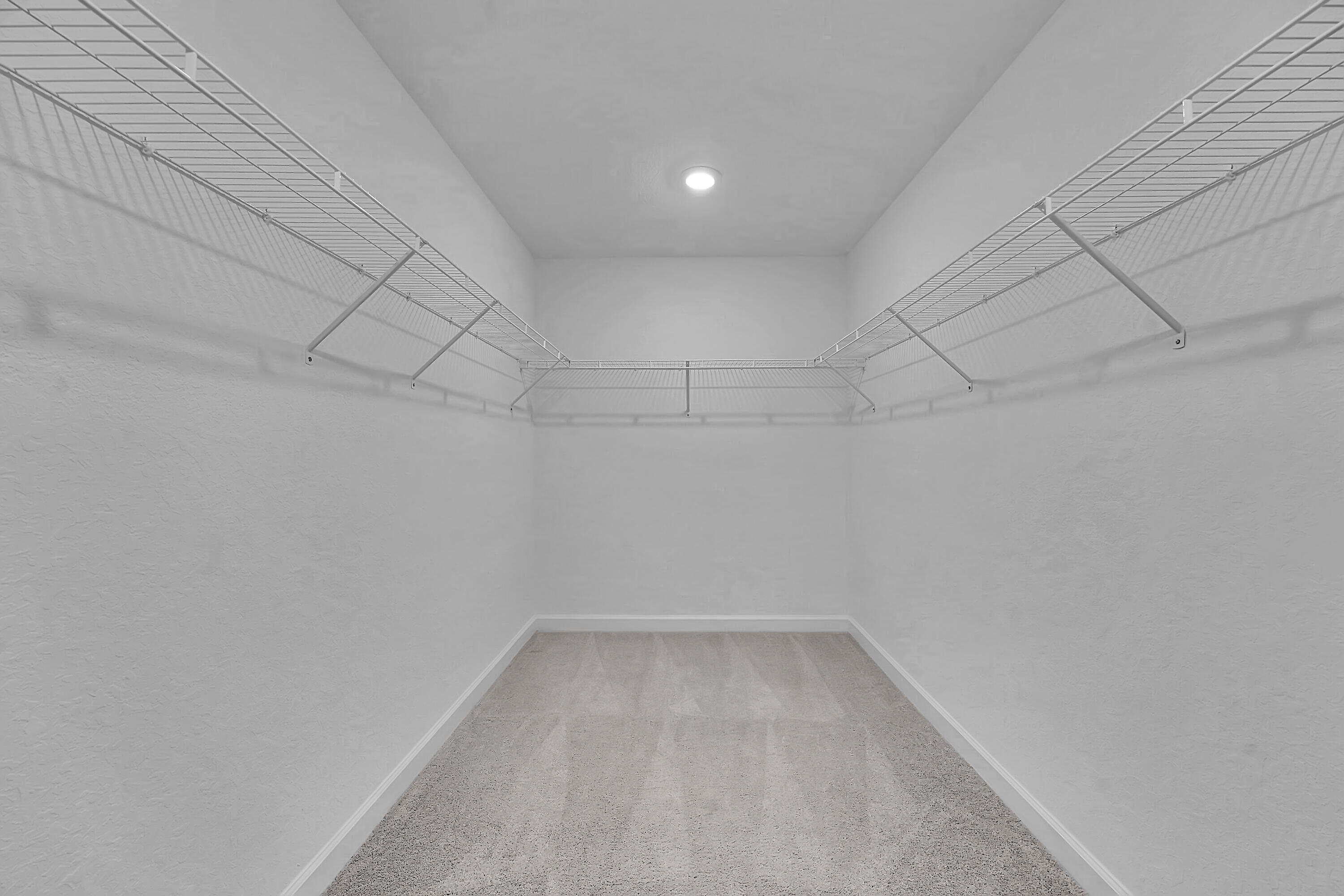 13096 Northwest Copper Creek Drive Port St. Lucie, FL 34987 - Photo 25 of 64 a view of a room with racks on the wall