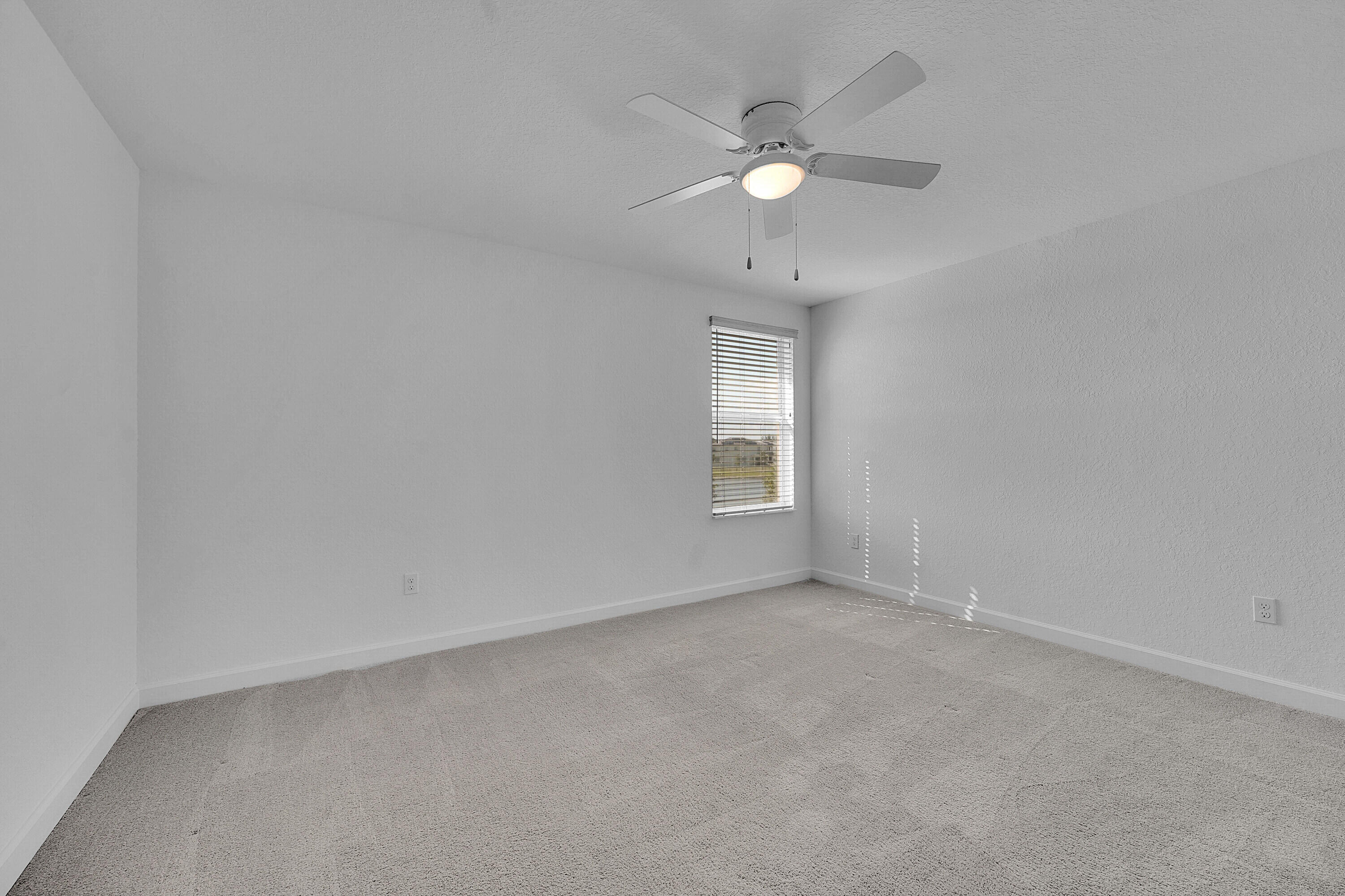 13096 Northwest Copper Creek Drive Port St. Lucie, FL 34987 - Photo 28 of 64 an empty room with a window