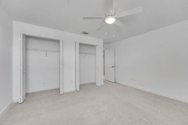 a view of a room with white walls