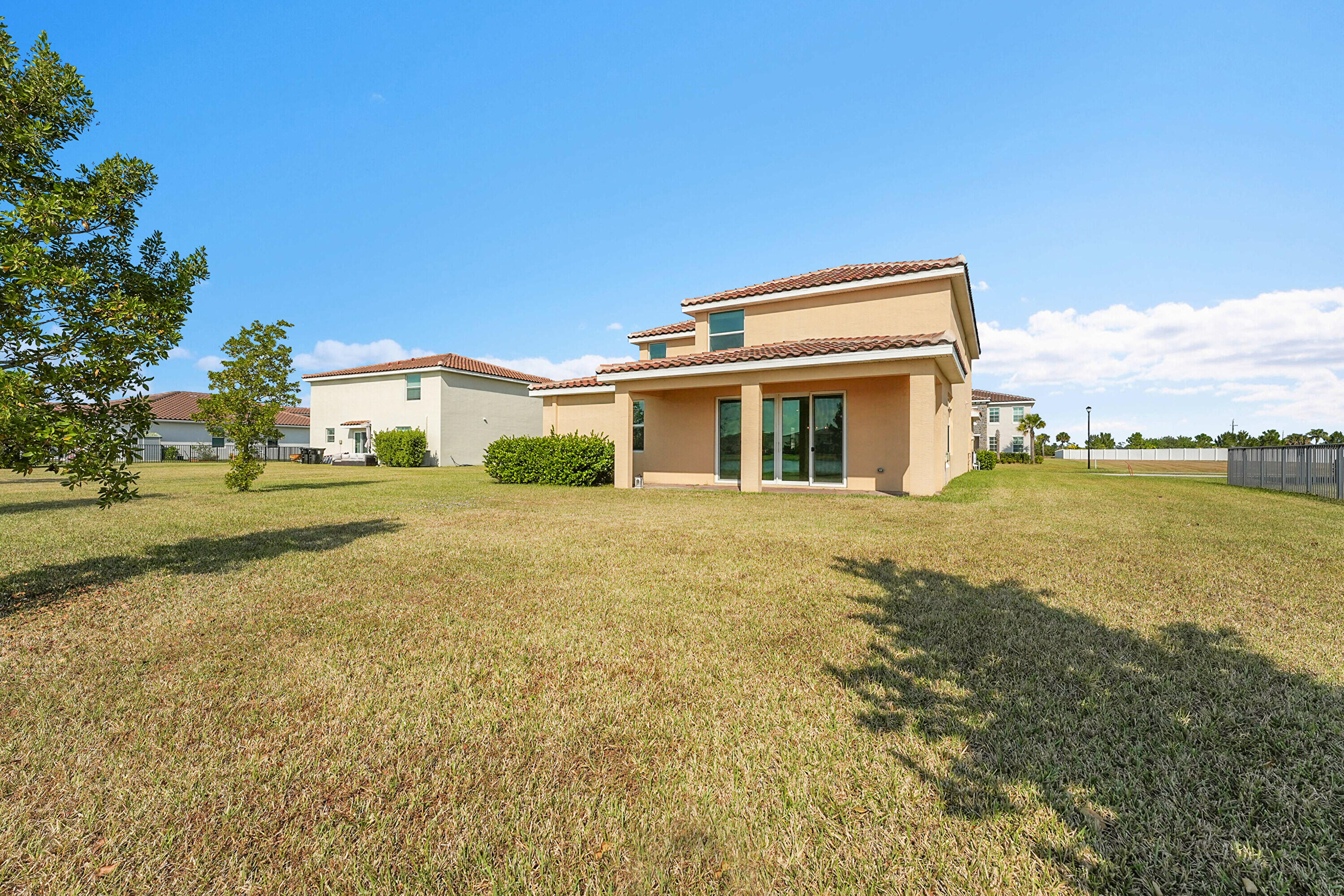 13096 Northwest Copper Creek Drive Port St. Lucie, FL 34987 - Photo 37 of 64 a house view with a swimming pool