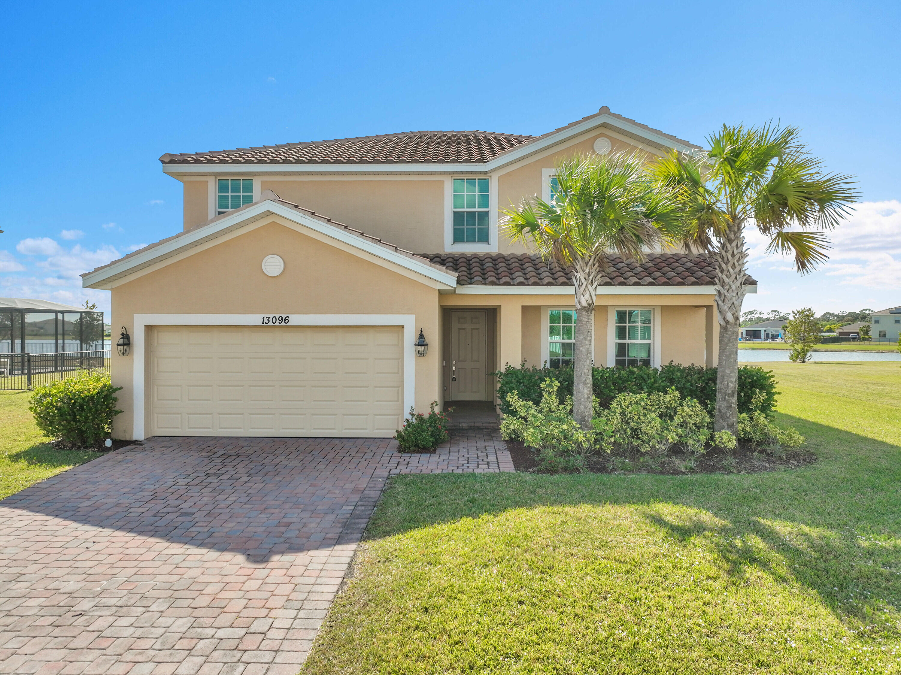 13096 Northwest Copper Creek Drive Port St. Lucie, FL 34987 - Photo 39 of 64 a front view of a house with garden