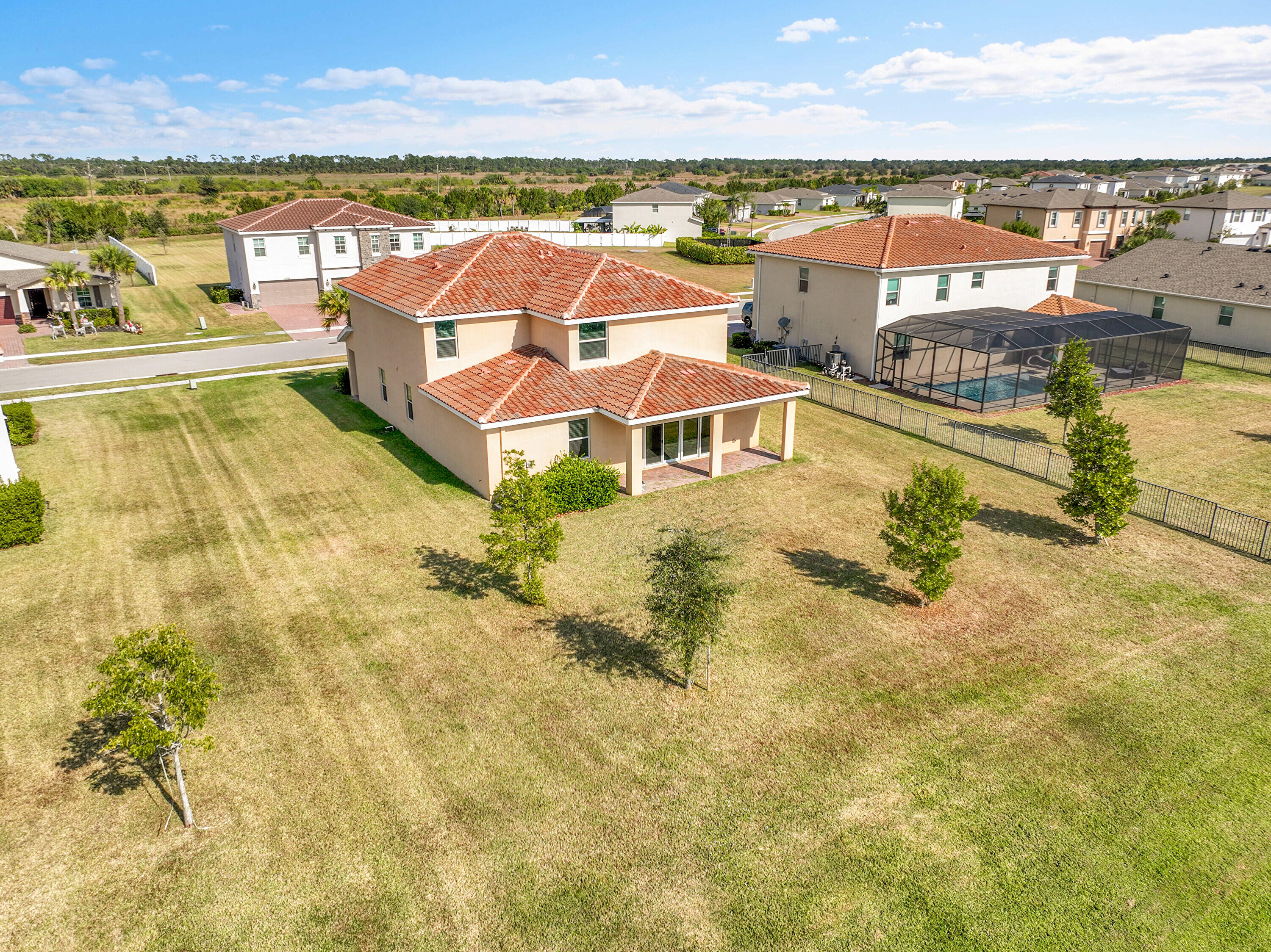 13096 Northwest Copper Creek Drive Port St. Lucie, FL 34987 - Photo 43 of 64 swimming pool view with a ocean view