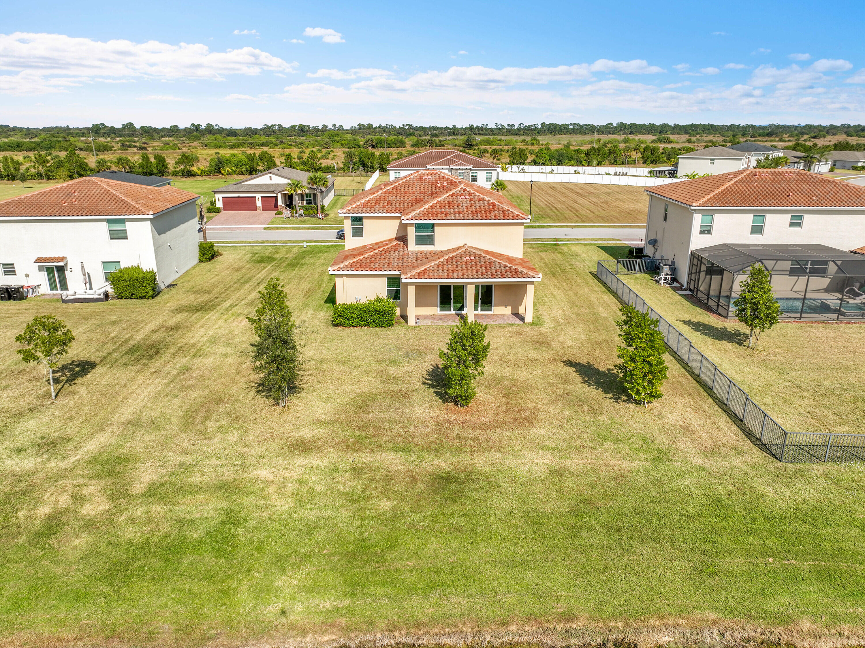 13096 Northwest Copper Creek Drive Port St. Lucie, FL 34987 - Photo 44 of 64 a view of a city with lawn chairs