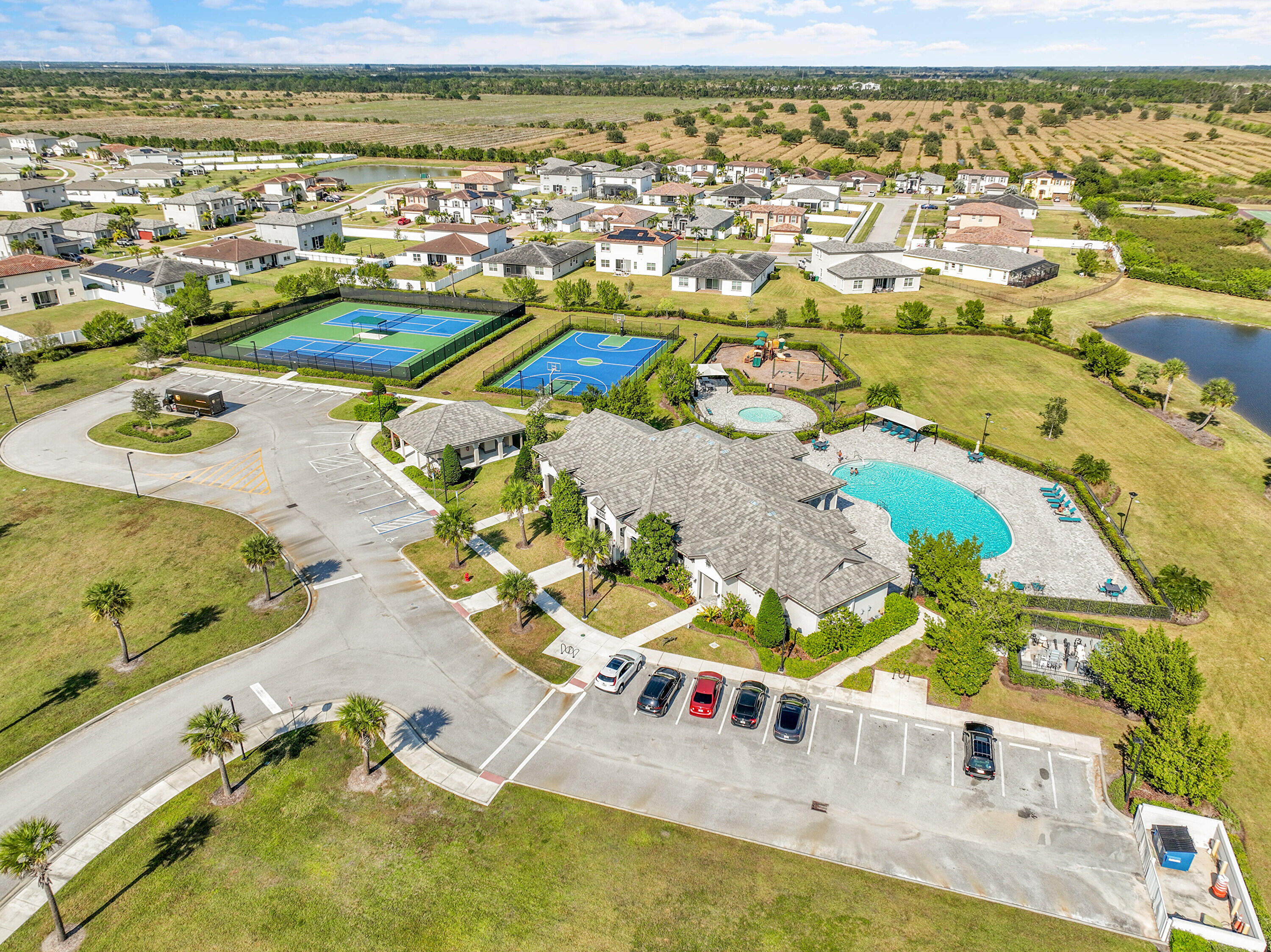 13096 Northwest Copper Creek Drive Port St. Lucie, FL 34987 - Photo 54 of 64 an aerial view of residential houses with outdoor space