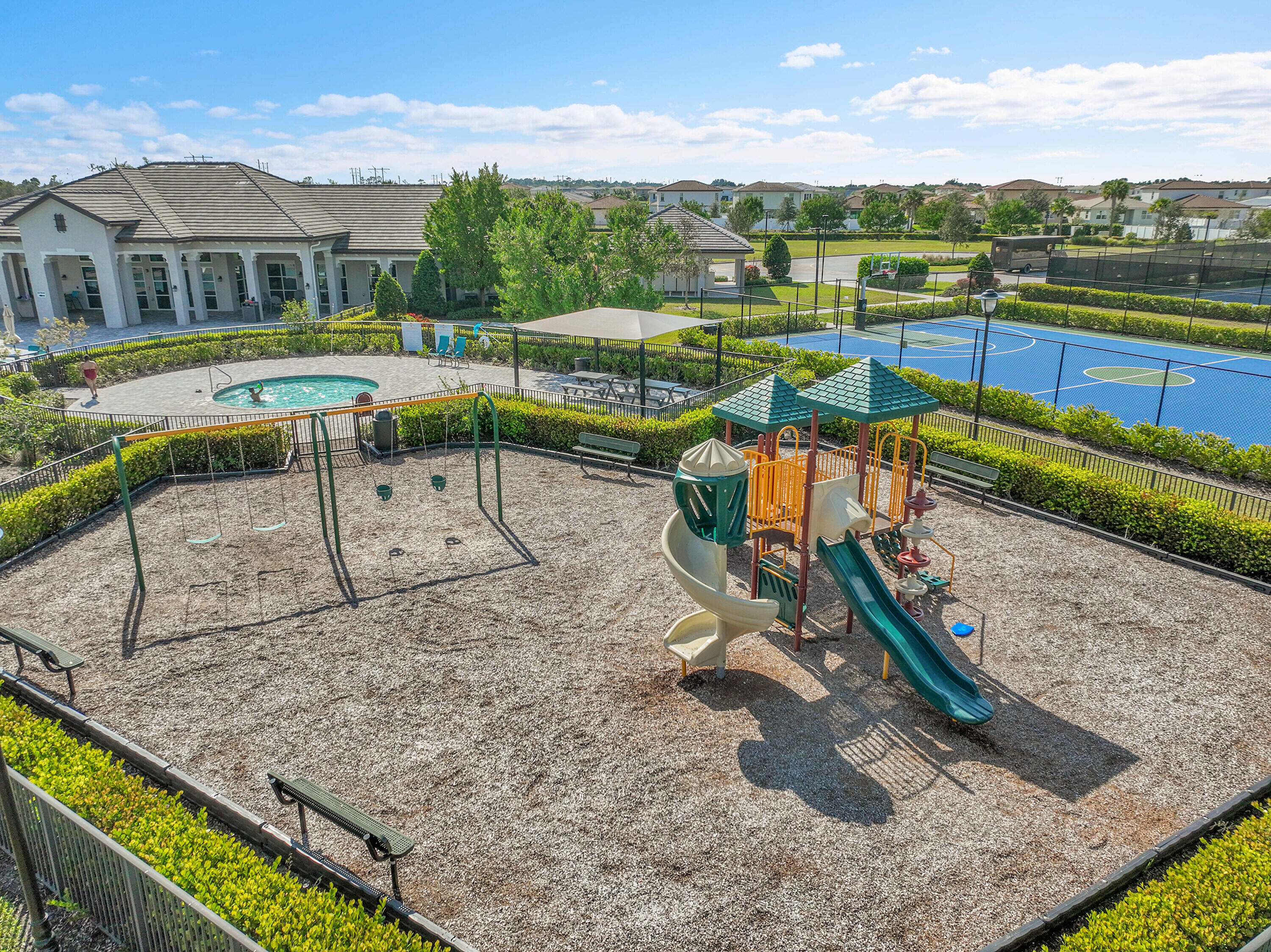 13096 Northwest Copper Creek Drive Port St. Lucie, FL 34987 - Photo 56 of 64 a view of a swimming pool with a lounge chairs