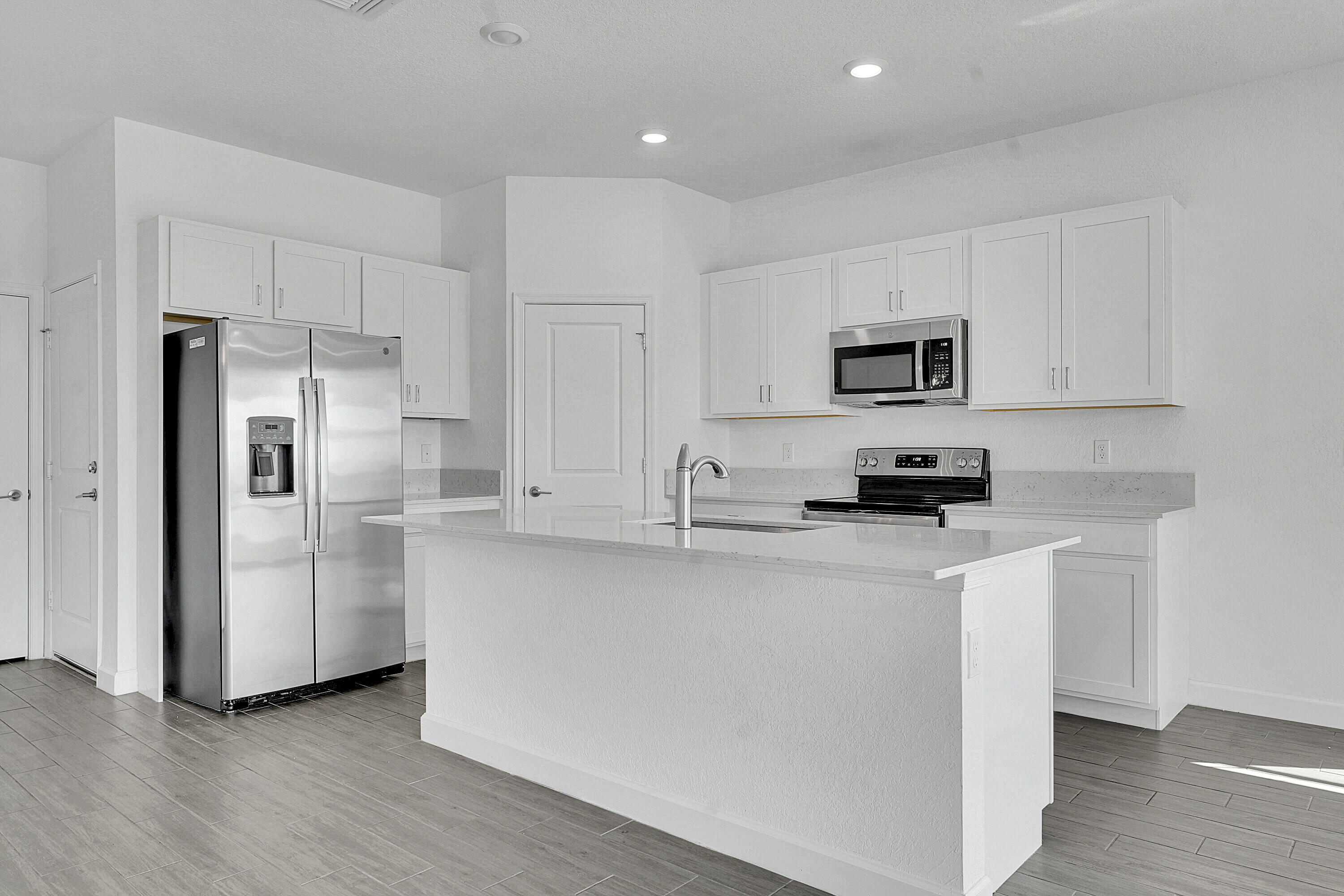 13096 Northwest Copper Creek Drive Port St. Lucie, FL 34987 - Photo 10 of 64 a kitchen with stainless steel appliances a refrigerator a stove top oven a sink and dishwasher