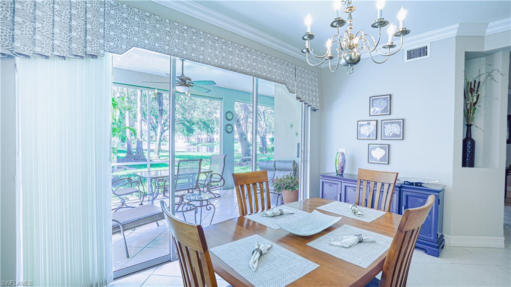 300 Diamond Circle, Unit 301 Naples, FL 34110 - Photo 12 of 43 a view of a dining room with furniture window and outside view