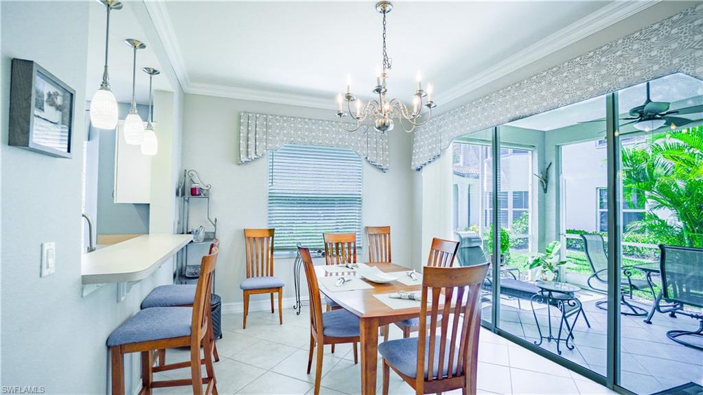 300 Diamond Circle, Unit 301 Naples, FL 34110 - Photo 18 of 43 a view of a dining room with furniture window and wooden floor