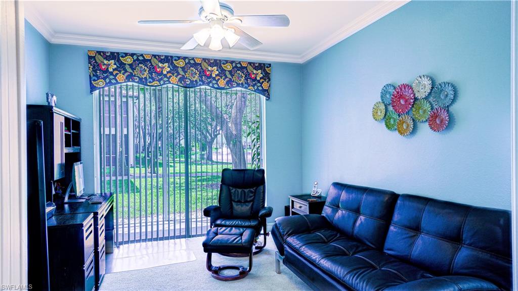 300 Diamond Circle, Unit 301 Naples, FL 34110 - Photo 32 of 43 a living room with furniture and a flat screen tv