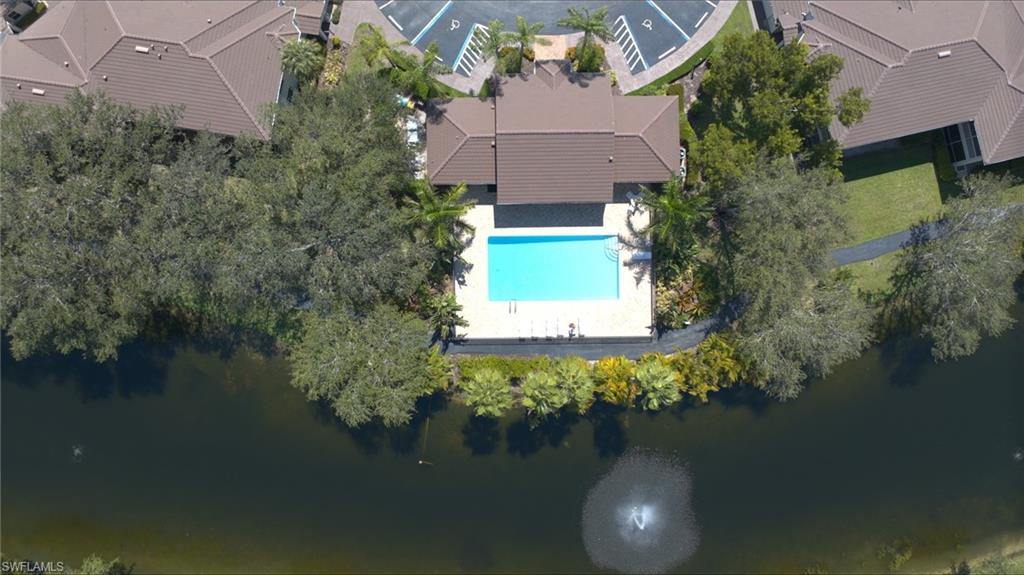 300 Diamond Circle, Unit 301 Naples, FL 34110 - Photo 33 of 43 an aerial view of house with yard and lake