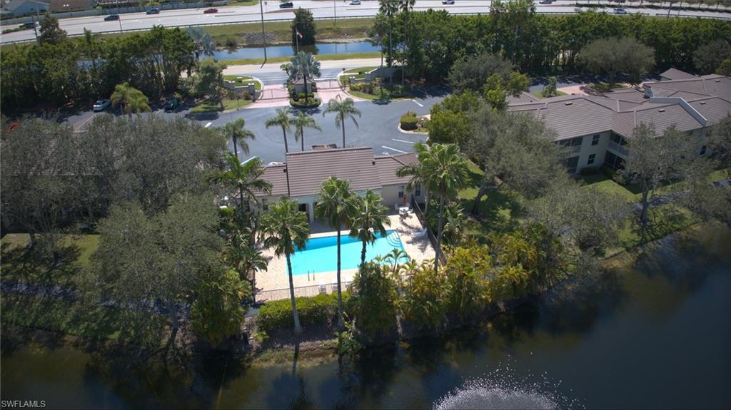 300 Diamond Circle, Unit 301 Naples, FL 34110 - Photo 35 of 43 a view of swimming pool and lake view