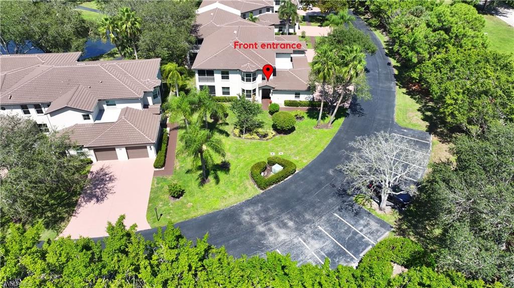 300 Diamond Circle, Unit 301 Naples, FL 34110 - Photo 43 of 43 an aerial view of multiple houses with yard