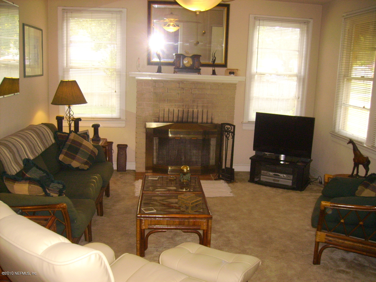 5146 Birkenhead Road Jacksonville, FL 32210 - Photo 5 of 13 a living room with furniture and a fireplace
