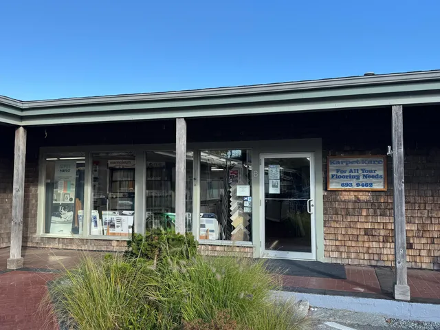 front view of a house with potted plants