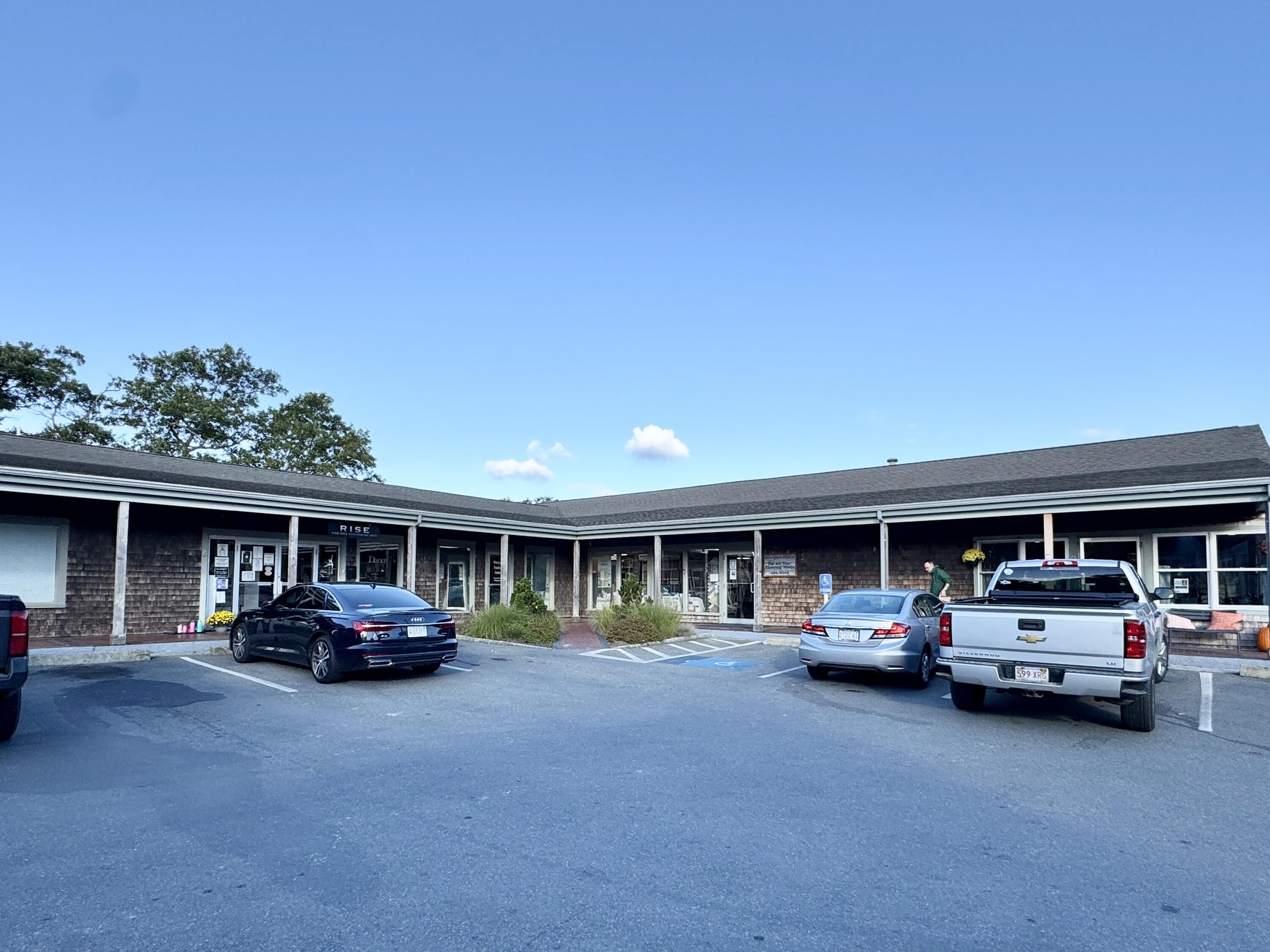 455 State Road, Unit 8 Vineyard Haven, MA 02568 - Photo 10 of 12 a car parked in front of building