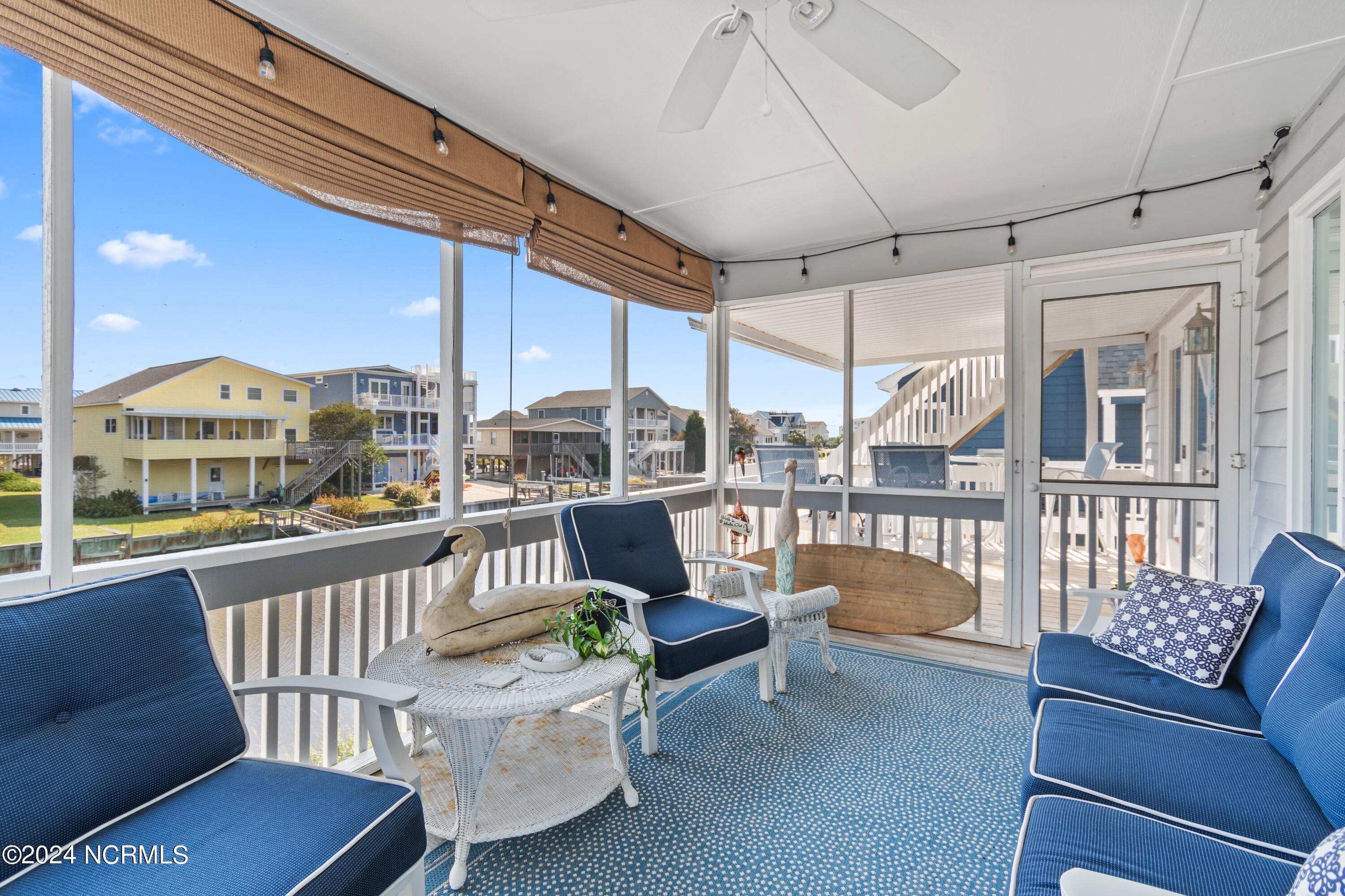 415 Sailfish Street Sunset Beach, NC 28468 - Photo 41 of 63 Screened porch.