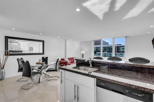 a living room with furniture and windows