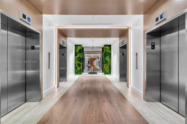 a view of an entryway door with wooden floor