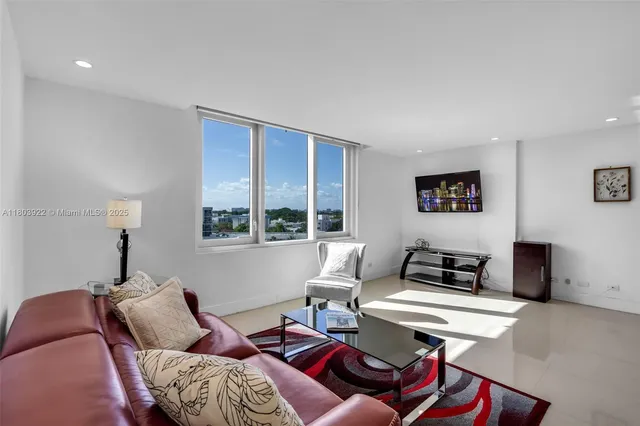 a living room with furniture and a window