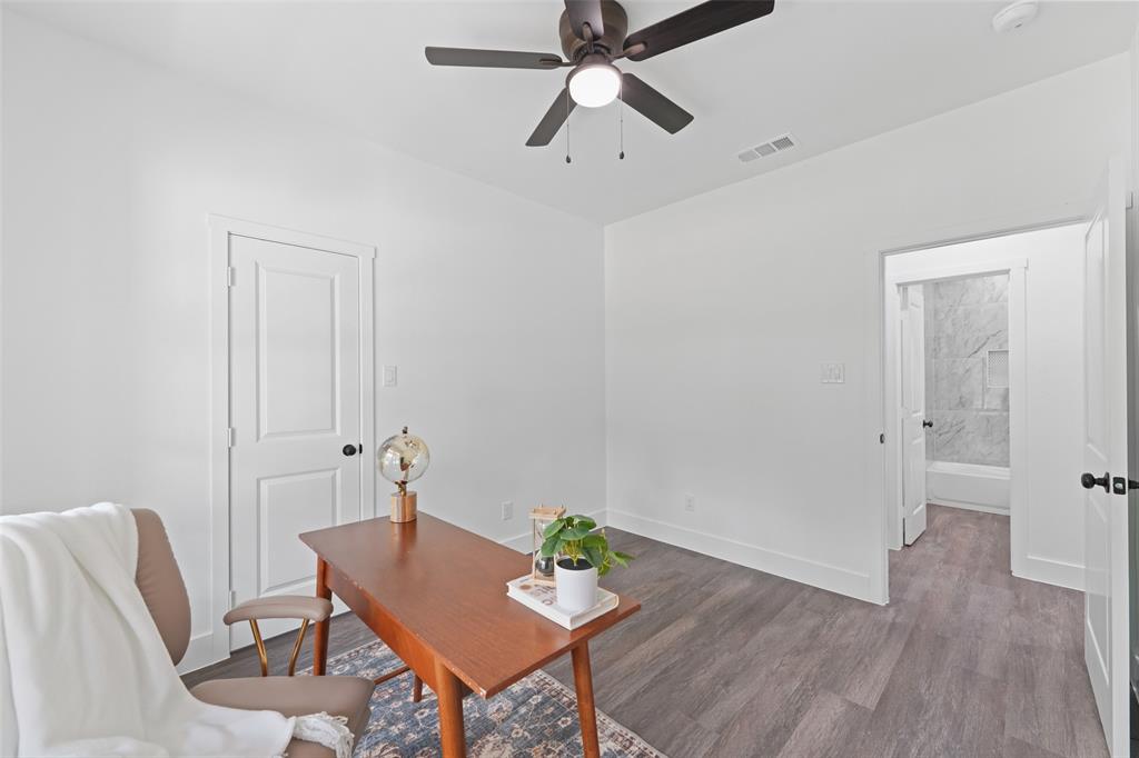 122 East Beachwood Loop Trinidad, TX 75163 - Photo 27 of 35 Versatile room featuring wood-finish flooring, a contemporary ceiling fan, and white baseboards