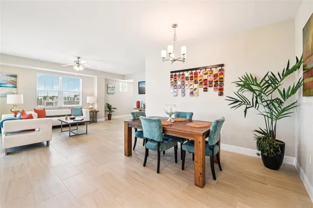 a view of a livingroom with furniture and a potted plant