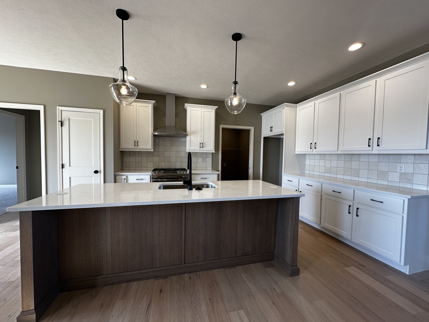 2523 Marble Road Normal, IL 61761 - Photo 5 of 23 a large kitchen with granite countertop a sink cabinets and wooden floor