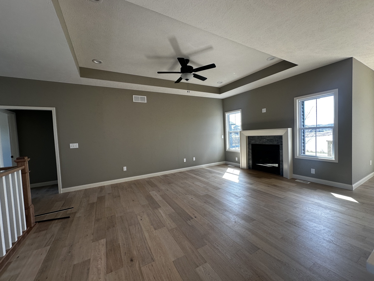 2523 Marble Road Normal, IL 61761 - Photo 9 of 23 an empty room with wooden floor fireplace and windows