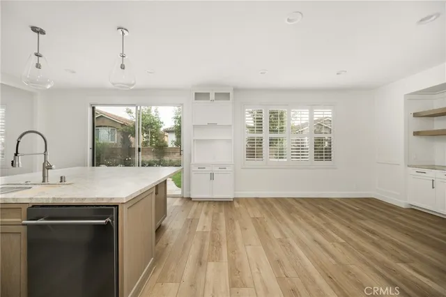a kitchen with a sink and a window