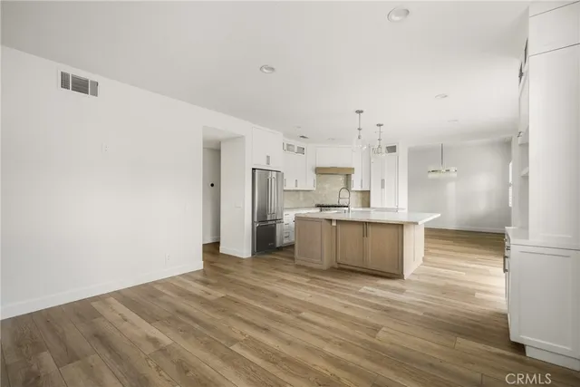 a view of kitchen with wooden floor