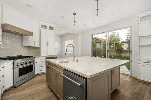 a kitchen with a stove and a sink