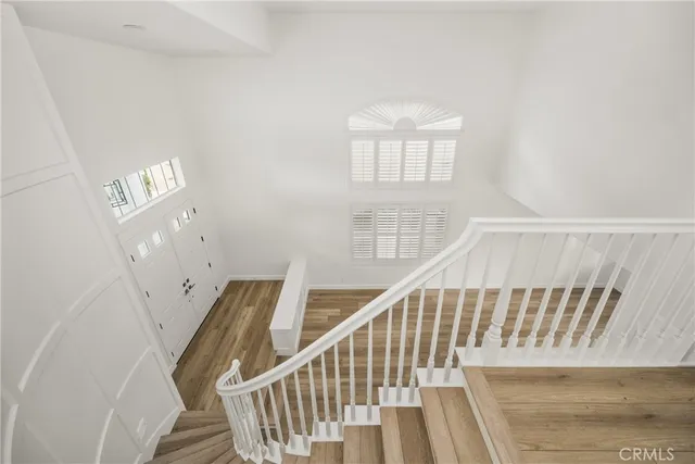 a view of entryway with stairs and wooden floor