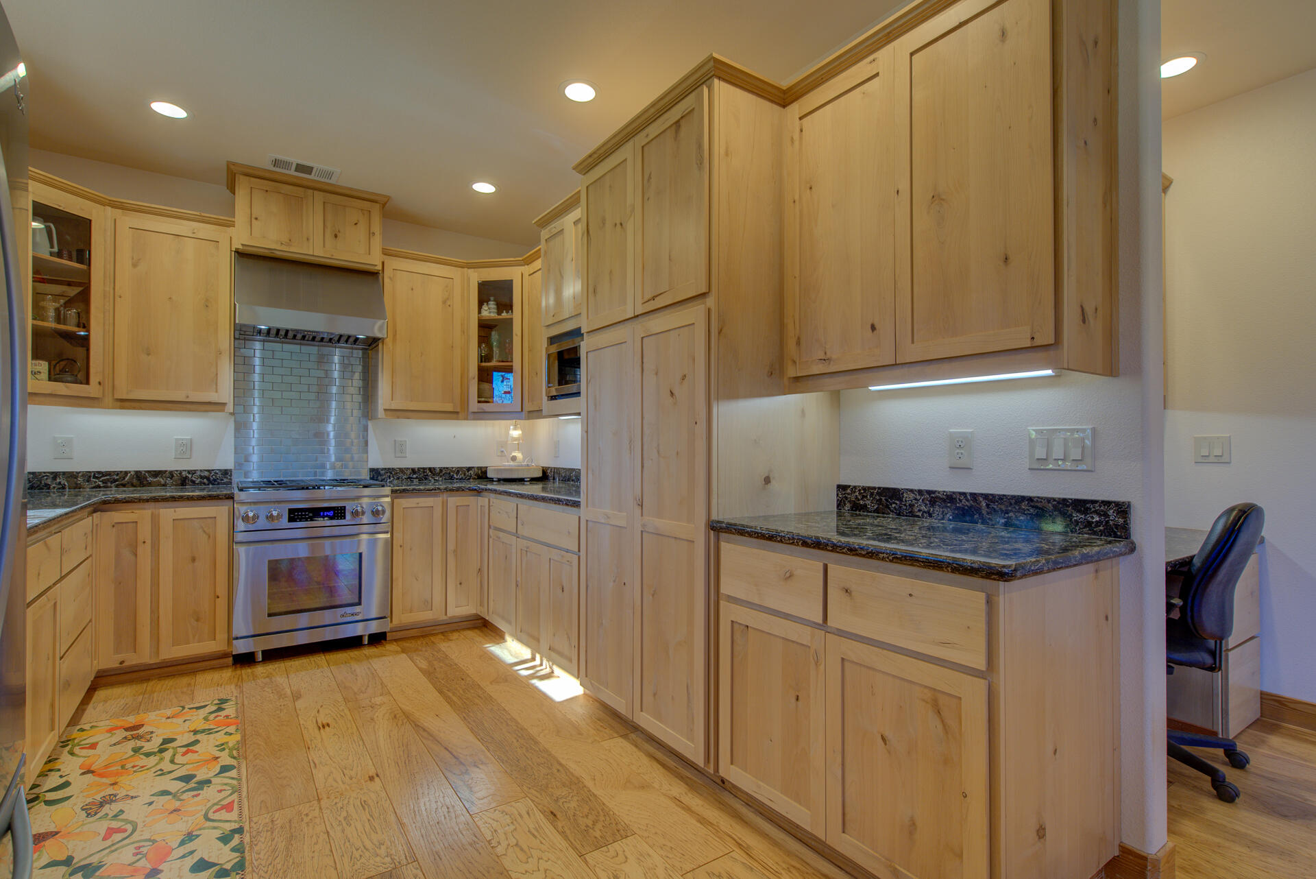 13575 English Way Oak Run, CA 96069 - Photo 17 of 56 a kitchen with stainless steel appliances granite countertop a stove a sink and a refrigerator
