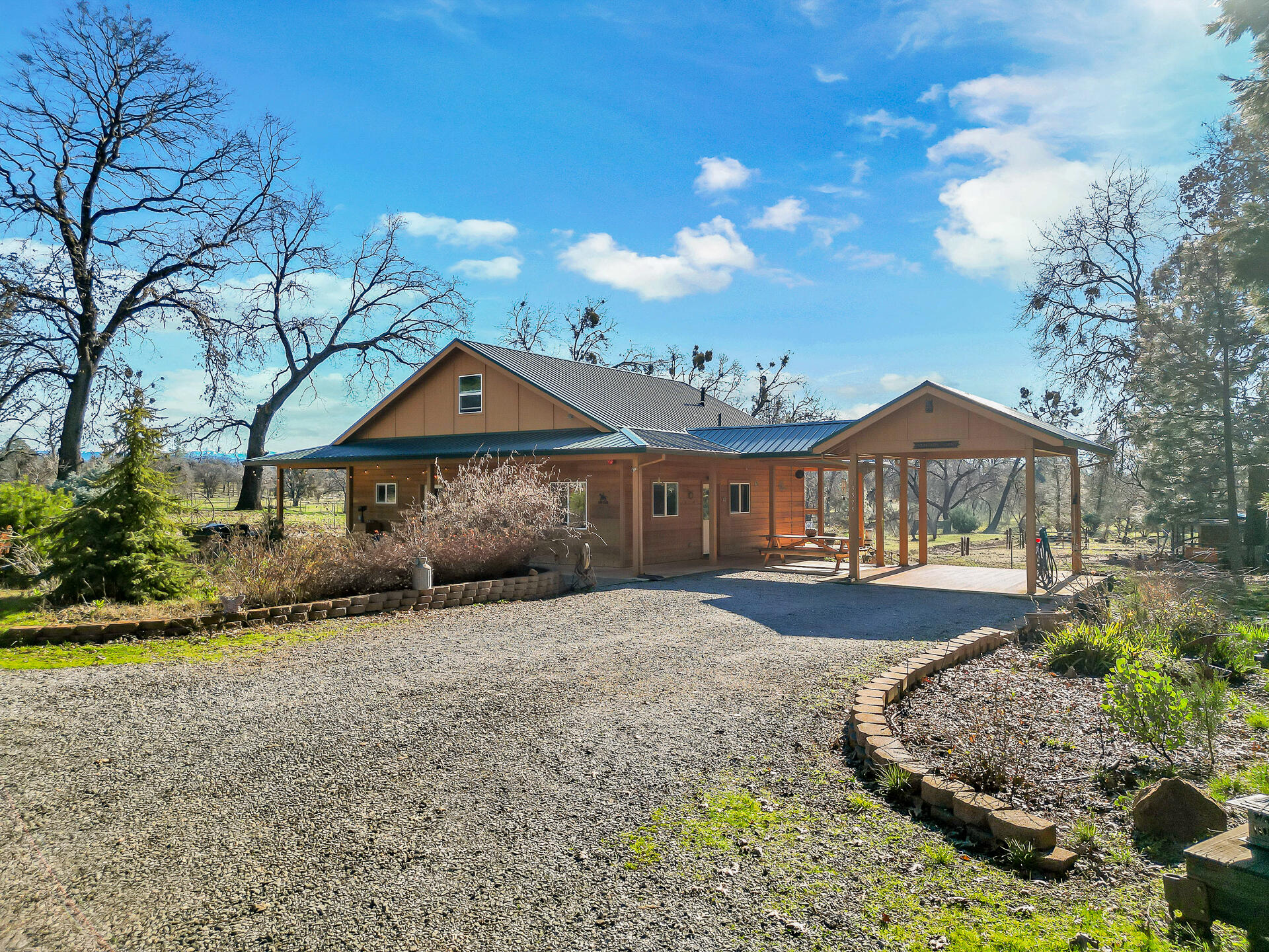 13575 English Way Oak Run, CA 96069 - Photo 2 of 56 a front view of a house with a yard and garage