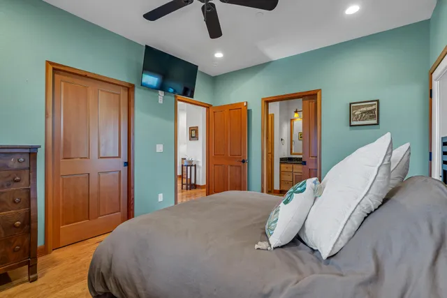 a view of a big room with a big yard and trees