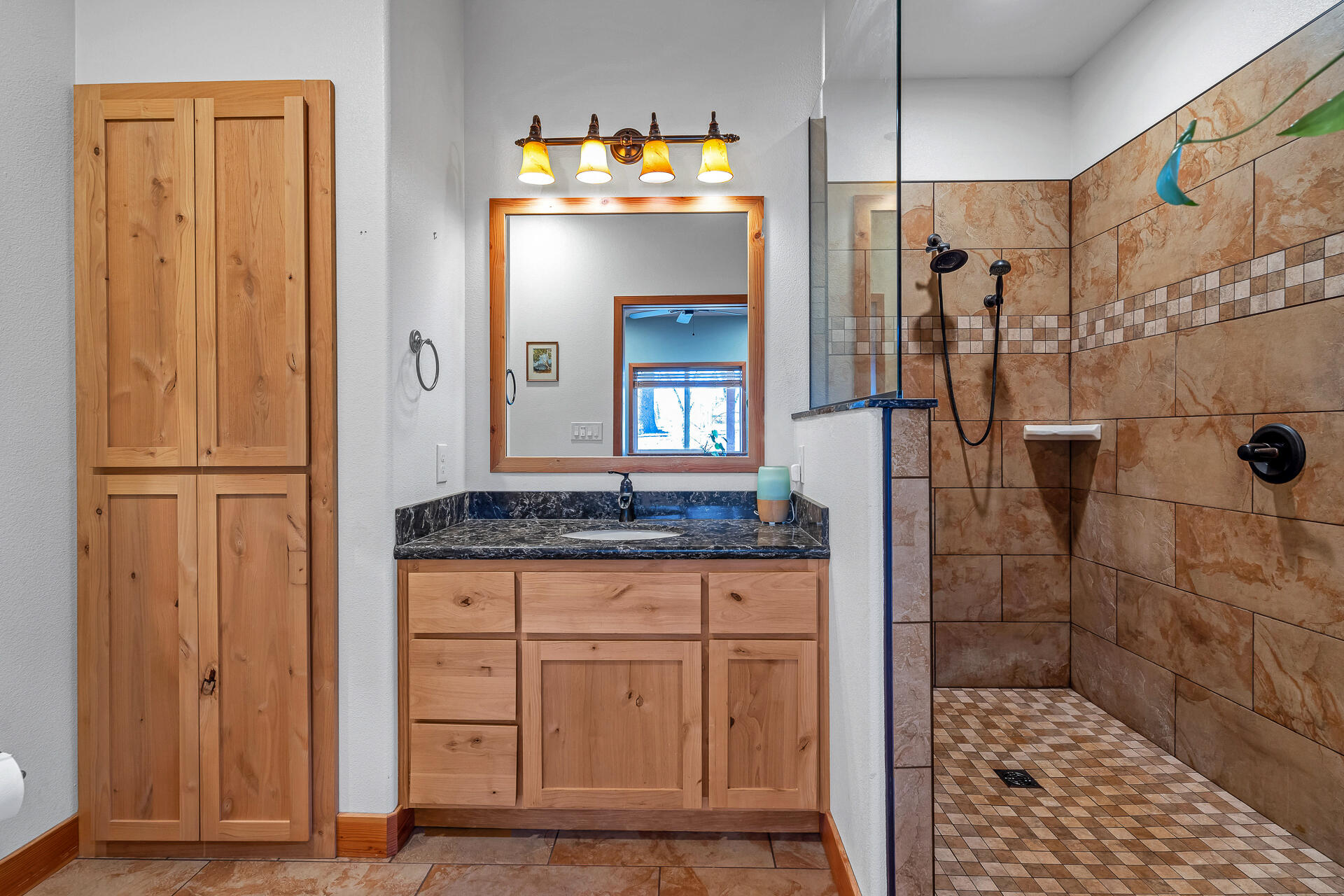 13575 English Way Oak Run, CA 96069 - Photo 24 of 56 a bathroom with a granite countertop sink a toilet and shower