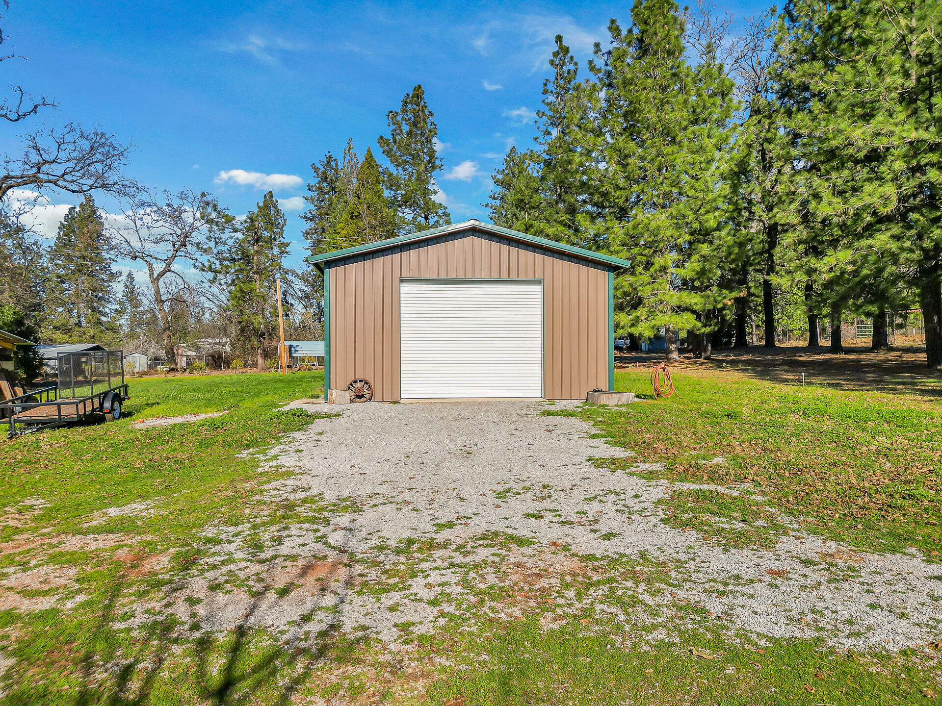 13575 English Way Oak Run, CA 96069 - Photo 49 of 56 a front view of a house with a yard and garage