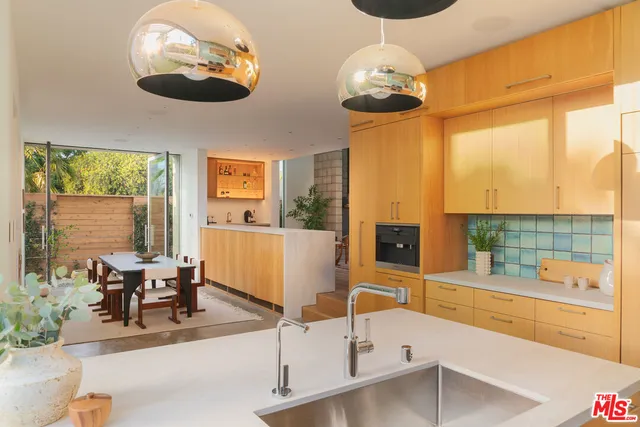 a lobby with furniture and large windows