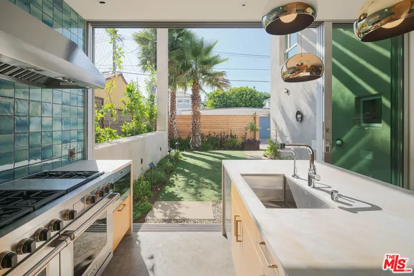 a kitchen with a sink and a stove