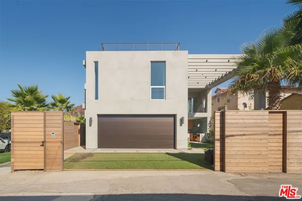 a bedroom with a chair and a mirror